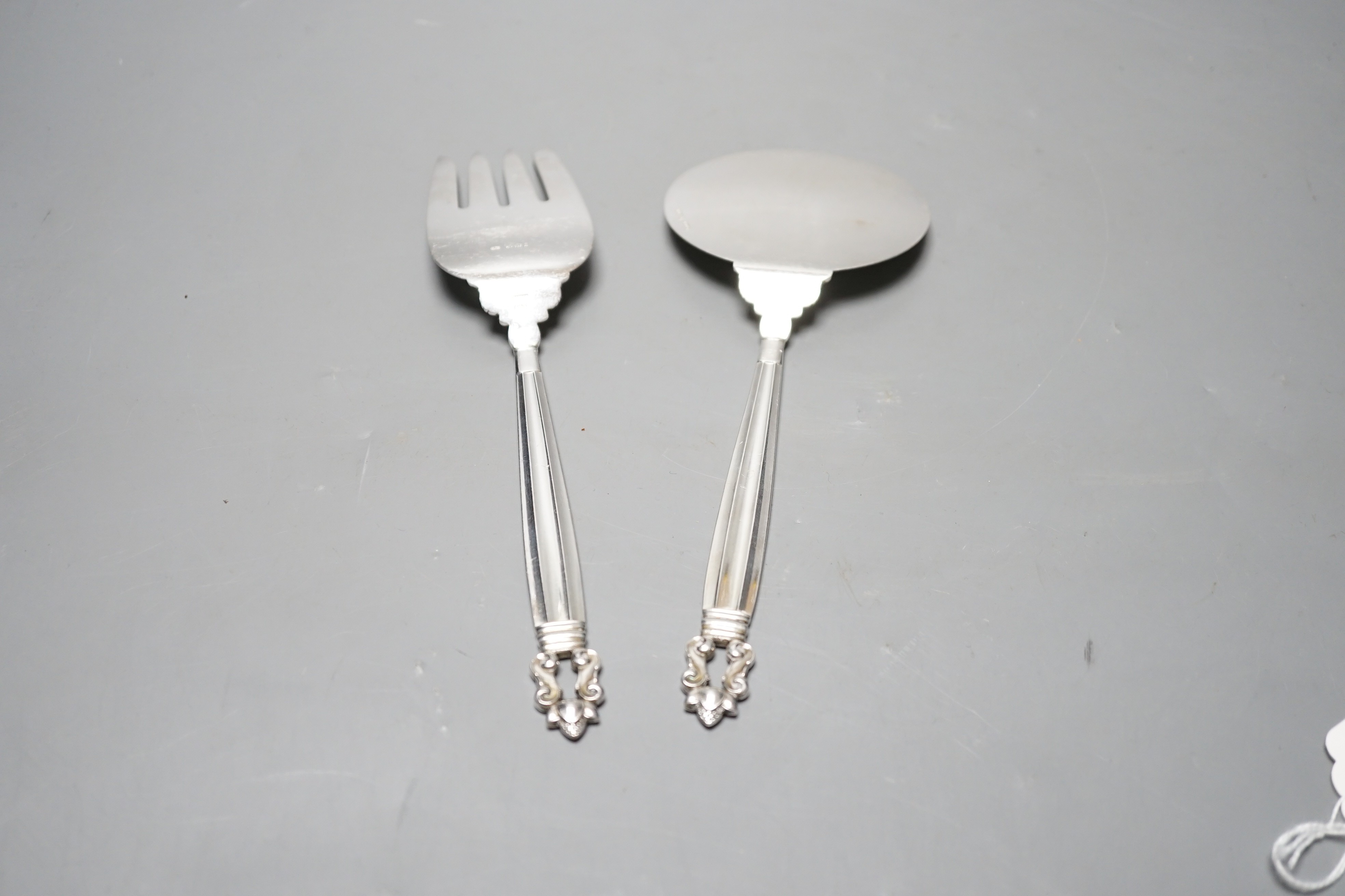 A boxed pair of Georg Jensen silver acorn pattern servers, London, import marks for 1967, 22.8cm, 6.2oz.